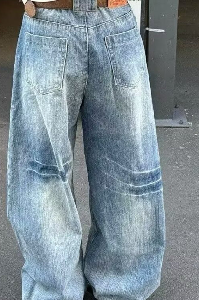 Curved Cut Wide Leg Distressed Jeans