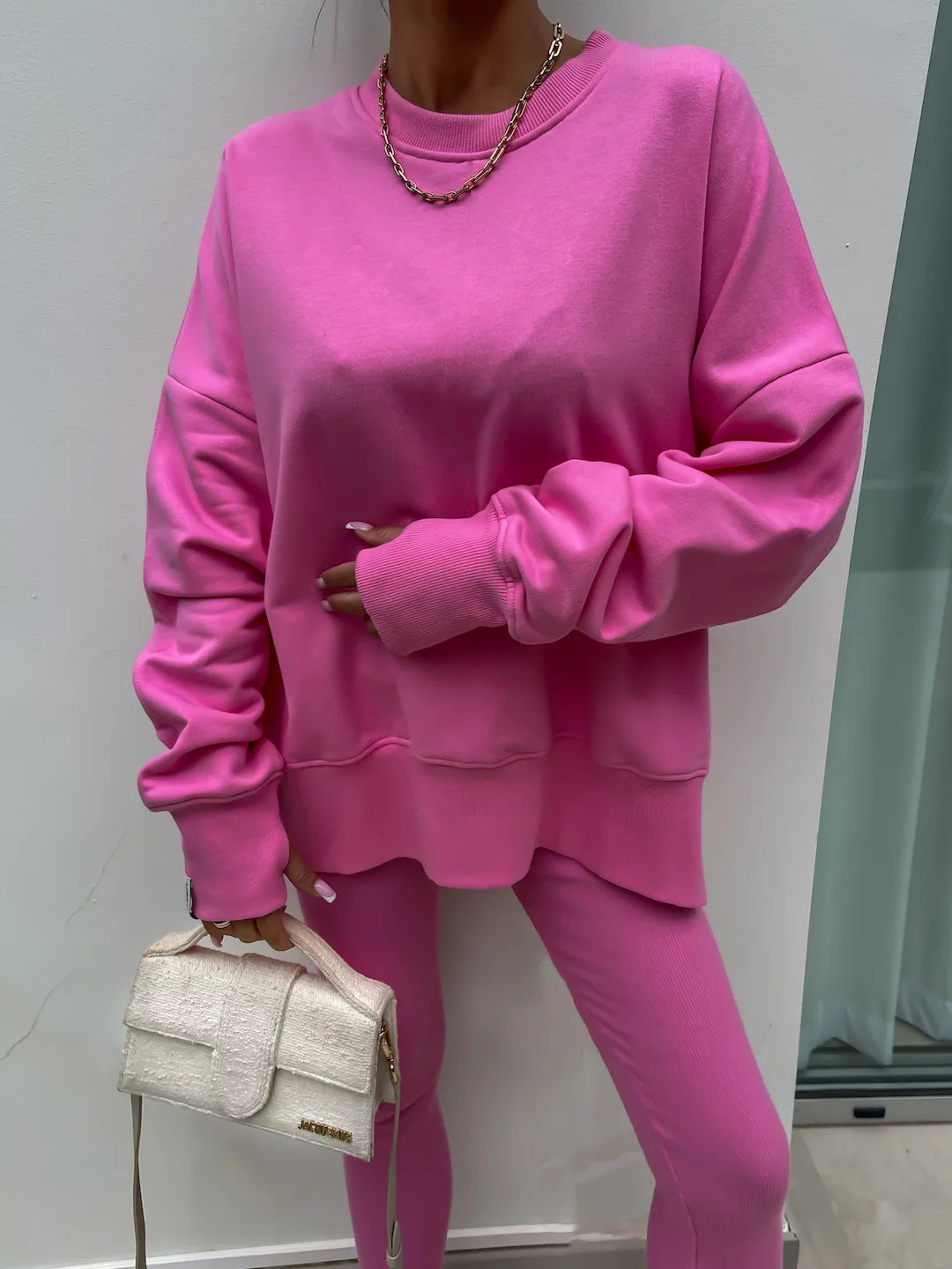 Loose long-sleeved round neck slit top and tight pants two-piece set