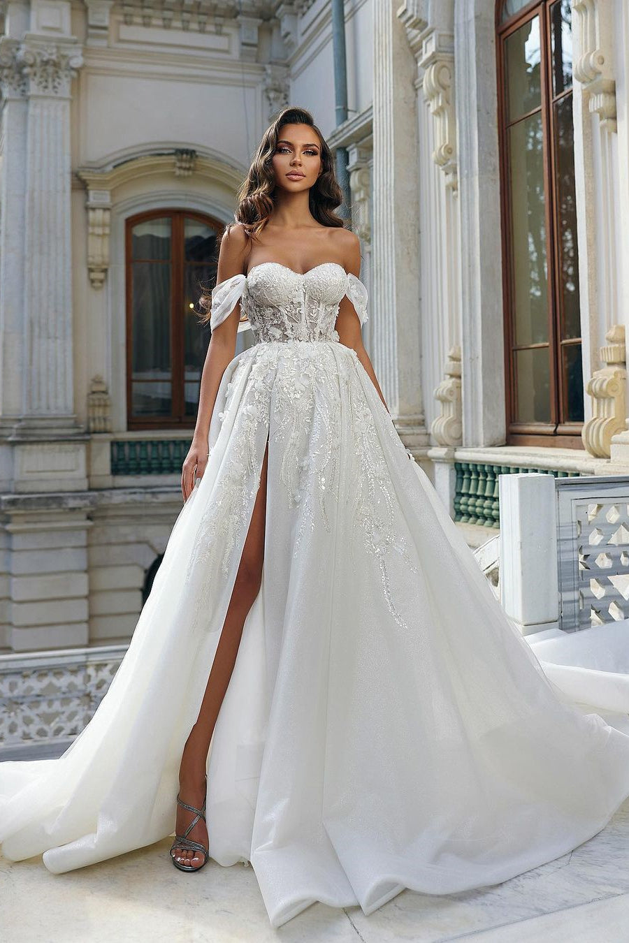 Beautiful Long White A-line Off-Shoulder Lace Wedding Dress with Delicate Floral Accents and a Slit - Fashionpara