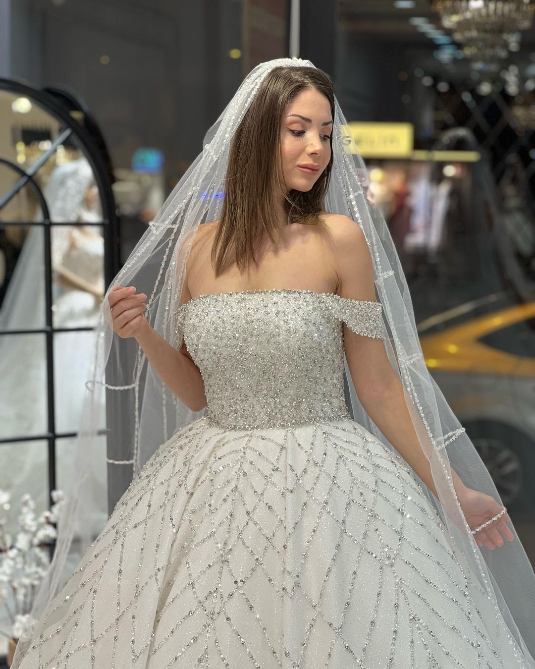 Charming Floor-Length Off-The-Shoulder A-Line Sequined Wedding Dress with Court Train - Fashionpara