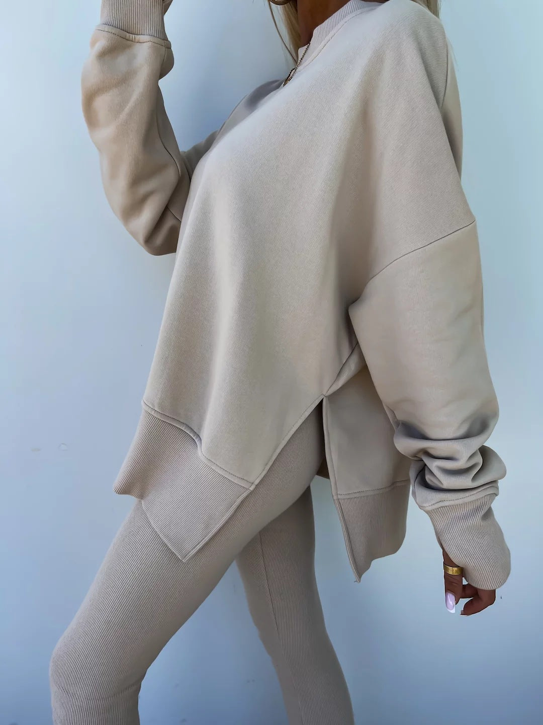 Loose long-sleeved round neck slit top and tight pants two-piece set