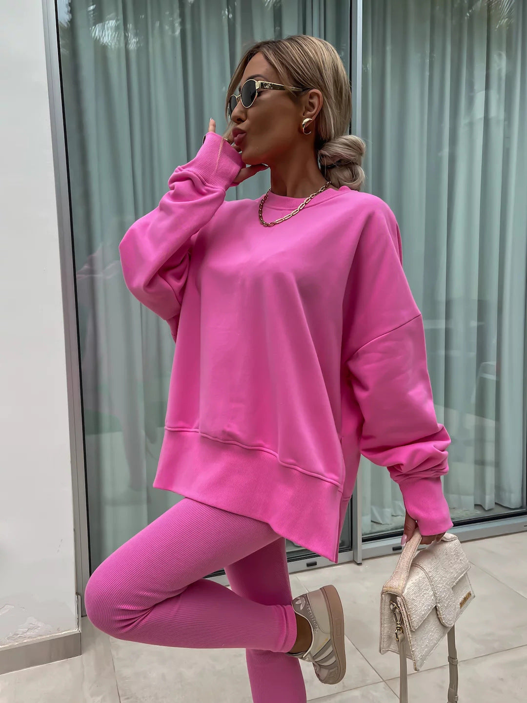 Loose long-sleeved round neck slit top and tight pants two-piece set