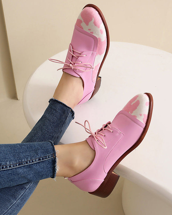 Round toe low-cut suede-trimmed cow-print loafers