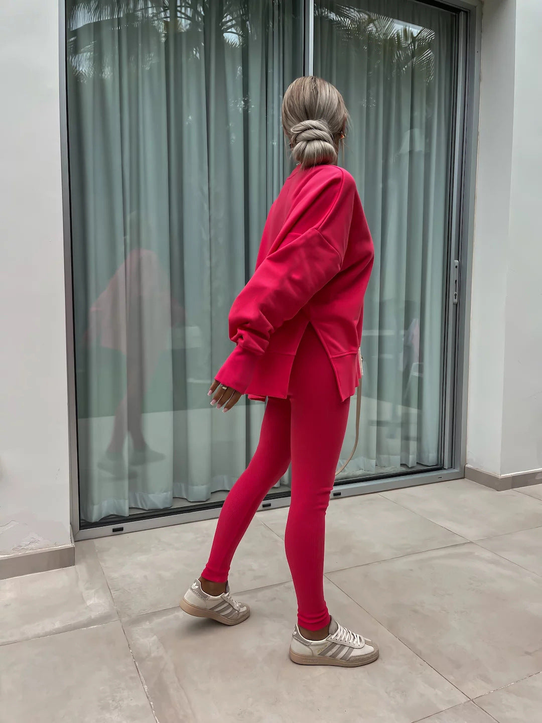 Loose long-sleeved round neck slit top and tight pants two-piece set