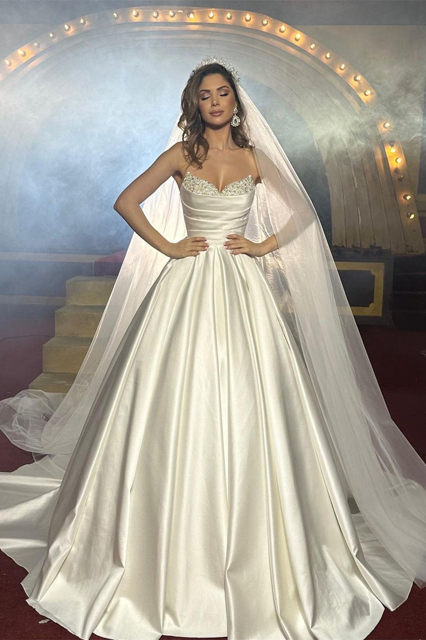 Graceful Floor-Length Sleeveless Satin Wedding Dress with Subtle Bead Details - Fashionpara